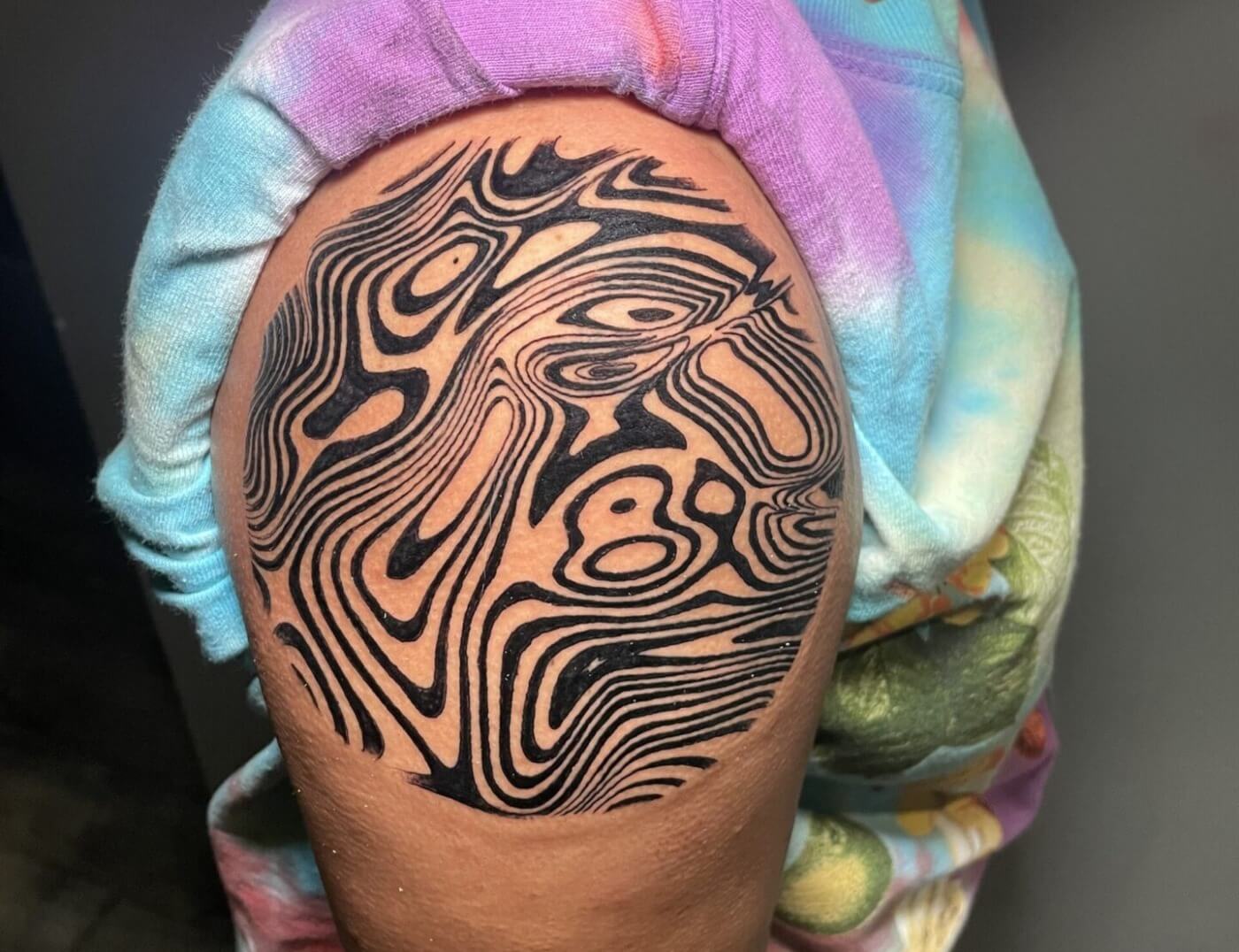 Abstract tattoo inked by Lyric, The Artist at Iron Palm Tattoos & body Piercing in downtown Atlanta. Walk-Ins are accepted. Call 404-973-7828 or come by for a free consultation.