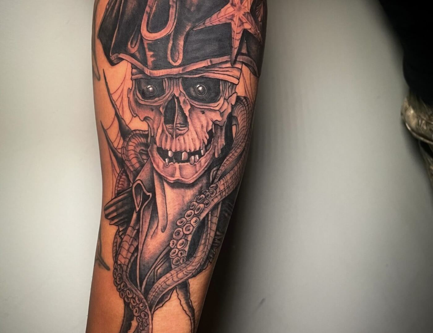 Dead Pirate or Dead Colonial soldier? What do you think? Surreal Photo-realism tattoo by Lyric The Artist at Iron Palm Tattoos In Downtown Atlanta. Call 404-973-7828 or stop by for a free consultation. Walk-Ins are always welcome.