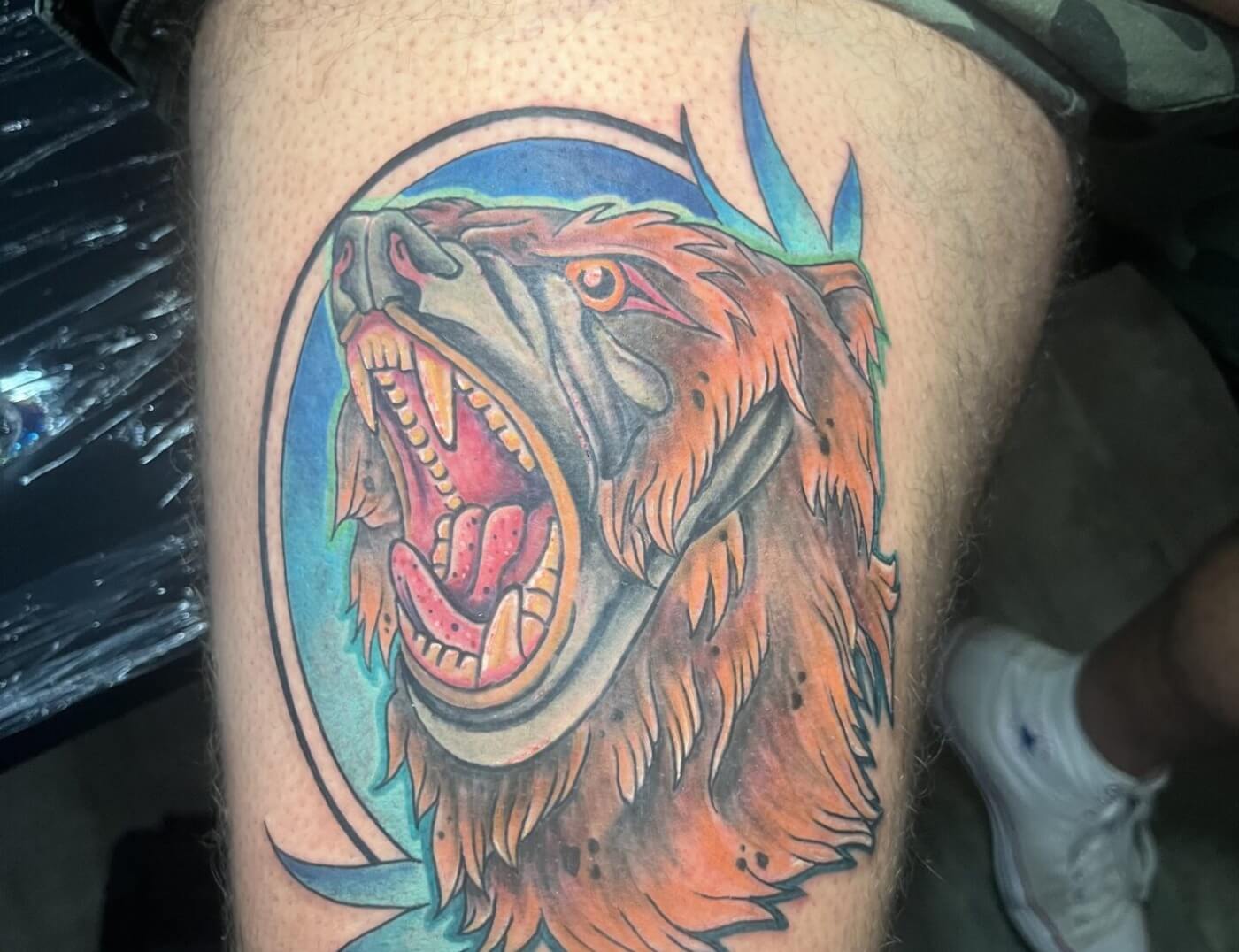 Color Kodiak bear tattoo by artist Paper Airplane Jane in downtown Atlanta at Iron Palm Tattoos. Call 404-973-7828 or stop by for a free consultation to book Jane.