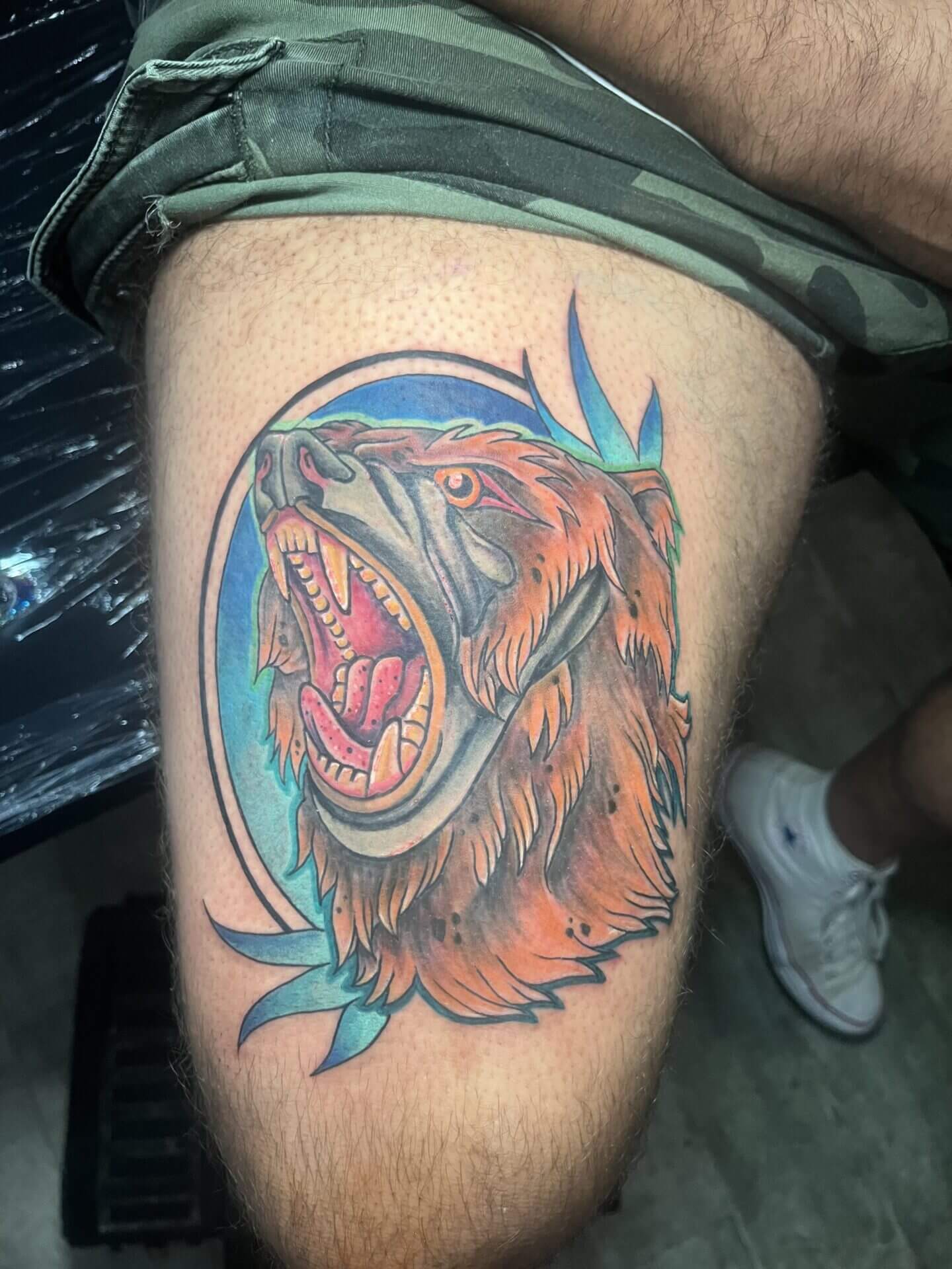 Color Kodiak bear tattoo by artist Paper Airplane Jane in downtown Atlanta at Iron Palm Tattoos. Call 404-973-7828 or stop by for a free consultation to book Jane.