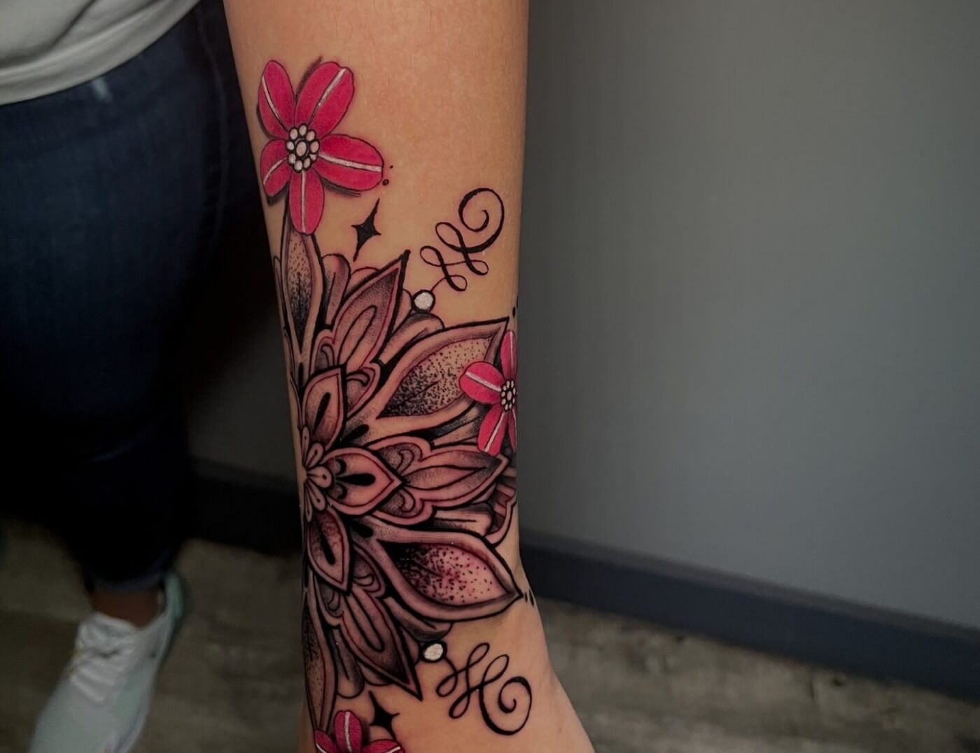 Flower mandala tattoo by Lyric The Artist at Iron Palm Tattoos & Body Piercing in downtown Atlanta, GA. We're open late night til 2AM most nights. Call 404-973-7828 or stop by for a free consultation.