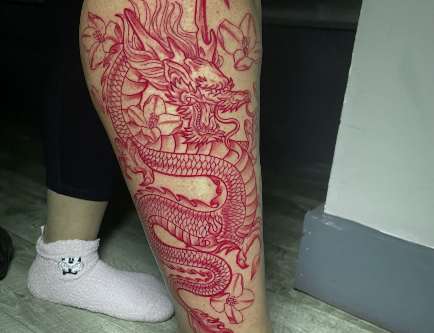 Red dragon animal tattoo inked by Lyric at Iron Palm Tattoos & body Piercing in downtown Atlanta's castleberry district. Call 404-973-7828. Walk-Ins welcome.