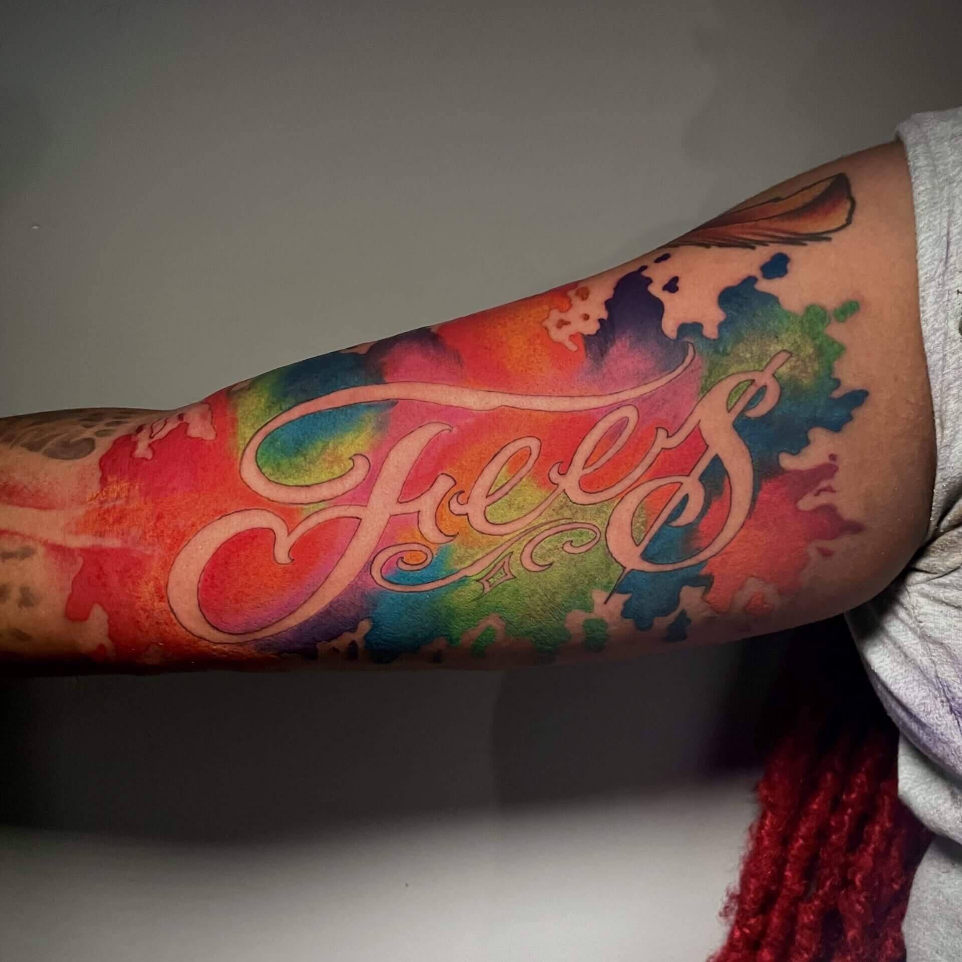 Water Color Script tattoo by Lyric the artist at Iron Palm Tattoos in Atlanta, Georgia. Walk-ins accepted. Call 404-973-7828 or stop by for a free consultation.