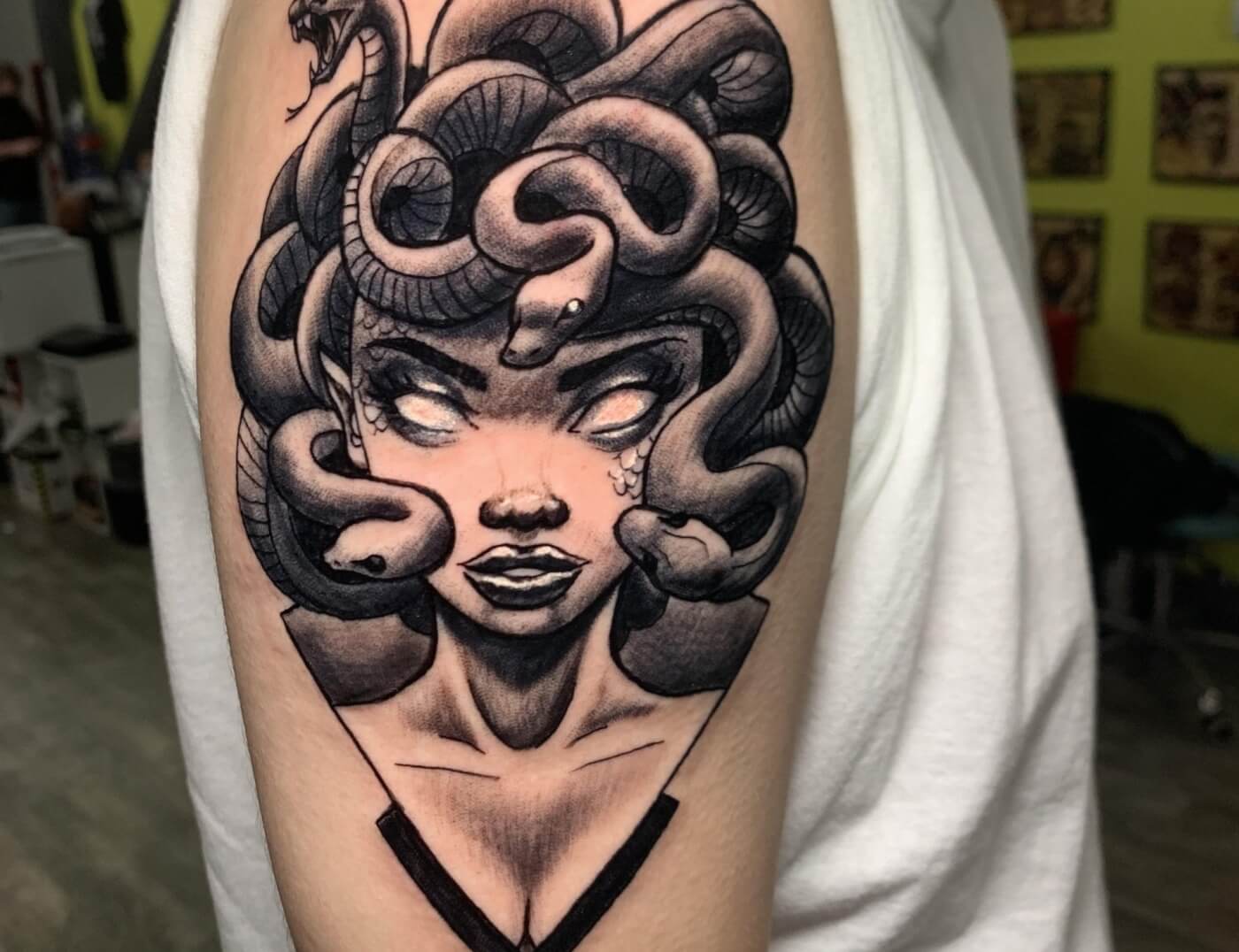 Medusa Black & Grey Anime Portrait Tattoo Created By J.R. Outlaw Of Iron Palm Tattoos & Body Piercing in Atlanta. We're open late night and walk ins are always welcome. Call 404-973-7828 or stop by for a free consultation.