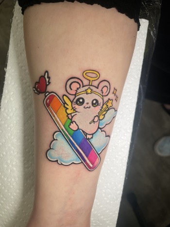 Hamtaro anime tattoo with LGBT pride colors inked by Lyric The Artist at Iron Palm Tattoos In downtown Atlanta, GA. Call 404-973-7828 or stop by for a free consultation. Walk-Ins are welcome.
