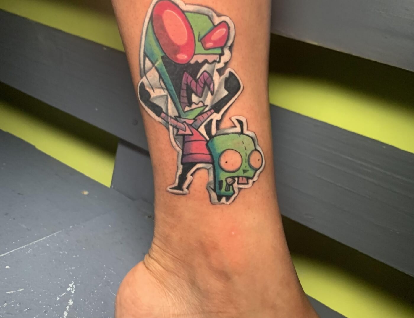 Invader Zin Anime Tattoo Designed And Inked By J.R. Outlaw Of Iron Palm Tattoos & Body Piercing. Anime tattoos are J.R.'s specialty and a favorite at Iron Palm. We're open late night until 2AM most nights. Call 404-973-7828 or stop by for a free consultation.