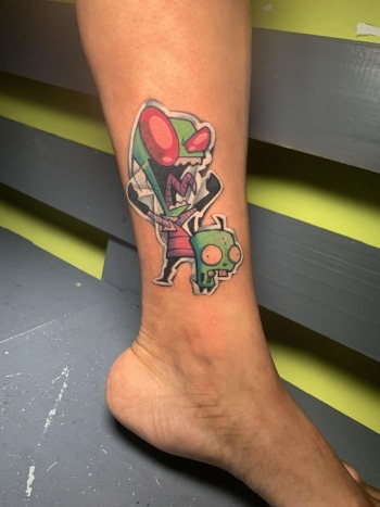 Invader Zin Anime Tattoo Designed And Inked By J.R. Outlaw Of Iron Palm Tattoos & Body Piercing. Anime tattoos are J.R.'s specialty and a favorite at Iron Palm. We're open late night until 2AM most nights. Call 404-973-7828 or stop by for a free consultation.