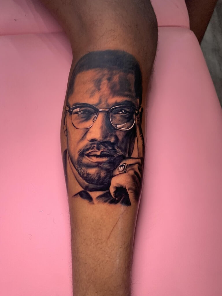 Malcolm X Photo Realism Memorial Portrait Tattoo By J.R. Outlaw of Iron Palm Tattoos & Body Piercing in downtown Atlanta.