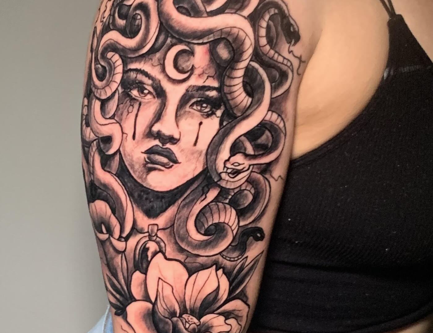 Muslim Medusa Portrait Black & Grey Tattoo With Flowers & Crescent Moon IBy J.R. Outlaw of Iron Palm Tattoos & Body Piercing in south downtown Atlanta. We're open late night until 2AM for tattoos. Call 404-973-7828 or stop by for a free consultation with JR Outlaw.