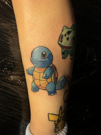 Pokemon Anime Tattoo Featuring Squirtle, Bulbasaur, and Pikachu by Artist J.R. Outlaw of Iron Palm Tattoos & Body Piercing in Downtown Atlanta, GA. Iron Palm is open late night until 2.A.M. most nights. Call 404-973-7828 or stop by for a free tattoo or piercing consultation.