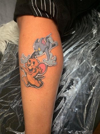Tom & Jerry Cartoon anime tattoo by J.R. Outlaw of Iron Palm Tattoos. Tom & Jerry are classic americana and we get more than a few requests to ink these animated legends. We're open late night until 2 AM most nights. Call 404-973-7828 or stop by for a free consultation.