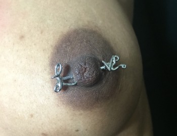 "Love" Barbell Nipple Piercing Installed at Iron Palm Tattoos & Body piercing in Atlanta Georgia. We like how the "O" in "love" is the nipple itself! Call 404-973-7828 or stop by for a free consultation with a body artist.