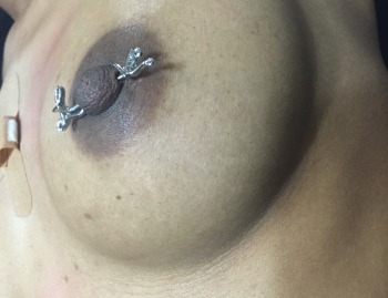 "Love" Nipple Barbell Piercing Jewelry installed at Iron Palm Tattoos & Body piercing in Atlanta Georgia. Call 404-973-7828 or stop by for a free consultation with an Iron Palm piercing artist. Walk-Ins are accepted during business hours.