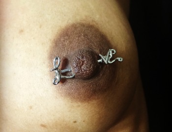 "Love" Nipple Barbell Piercing Jewelry installed at Iron Palm Tattoos & Body piercing in Atlanta Georgia. Call 404-973-7828 or stop by for a free consultation with an Iron Palm piercing artist. Walk-Ins are accepted during business hours.