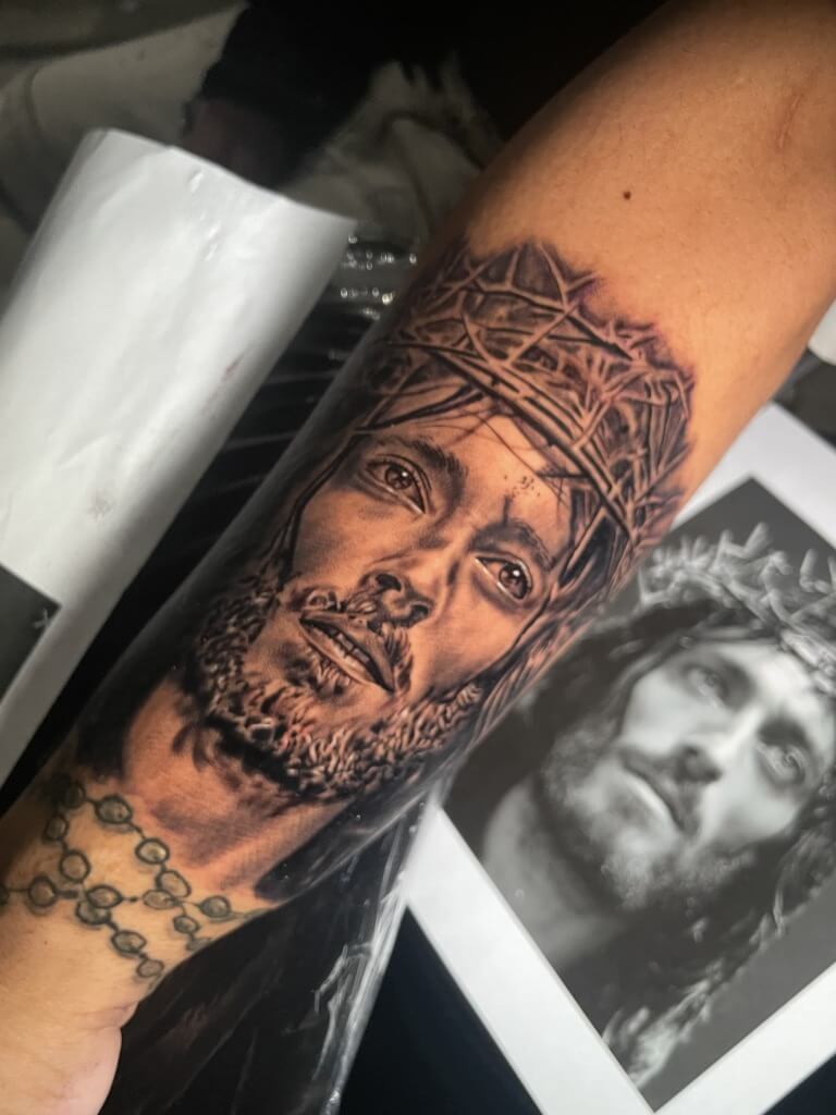 Robert Powell as Jesus Christ in 'Jesus of Nazareth' Photo Realism portrait tattoo interpreted and inked by tattoo artist T Sawyer at Iron Palm Tattoos in south downtown Atlanta, GA. Call 404-973-7828 or stop by for a free consultation.