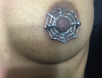 Spiderweb Barbell Nipple Piercing Jewelry installed at Iron Palm Tattoos in Atlanta. Call 404-973-7828 or stop by for a free consultation with a body artist on your next piercing. Walk Ins are welcome.