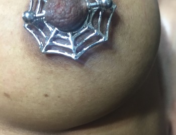 Spiderweb Barbell Nipple Piercing Jewelry installed at Iron Palm Tattoos in Atlanta. Call 404-973-7828 or stop by for a free consultation with a body artist on your next piercing. Walk Ins are welcome.