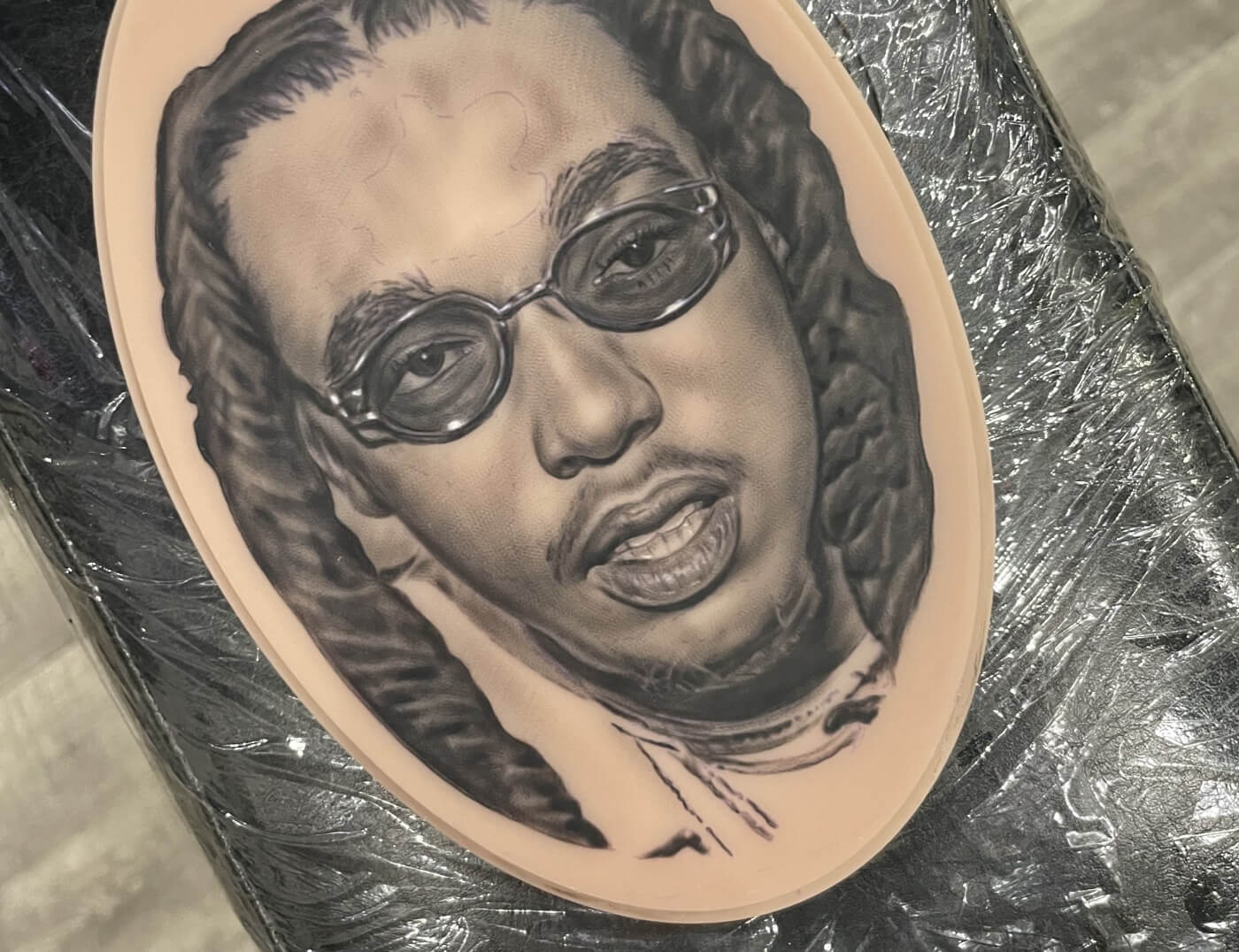 Take Off Photo Realism Portrait by T Sawyer at Iron Palm Tattoos & Body Piercing in downtown Atlanta, GA. The artwork is so good that Google images could match the likeness with the real person. Walk-Ins are accepted. Call 404-97307828 or stop by for a free consultation.