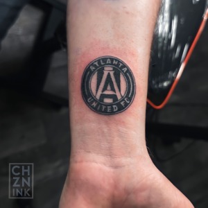 Atlanta United Soccer Brand Tattoo By Choze, an artist At Iron Palm Tattoos, In Downtown Atlanta. Call 404-973-7828 or stop by for a free consultation with an Iron Palm body artist. Walk-Ins are welcome.