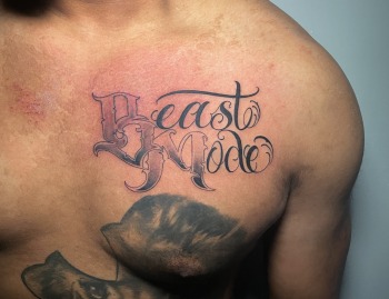 Beast Mode Lettering Script Tattoo With Black & Gray Gradient by Lyric TheArtist at Iron Palm Tattoos in Atlanta Georgia. We're open late night most nights until 2AM. Call 404-973-7828 or stop by for a free consultation with Lyric.