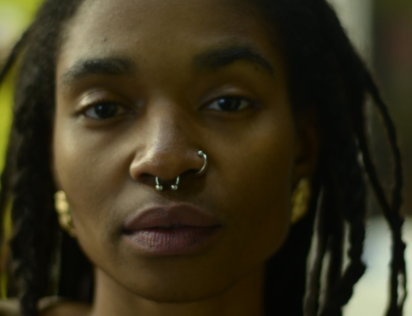 Septum and nose hoop piercing done by Mo8 at Iron Palm Tattoos & Body Piercing in downtown Atlanta's Castleberry Hill art district. Jewelry is included with the piercing service. Call 404-973-7828 or stop by for a free consultation with an Iron Palm body piercer.