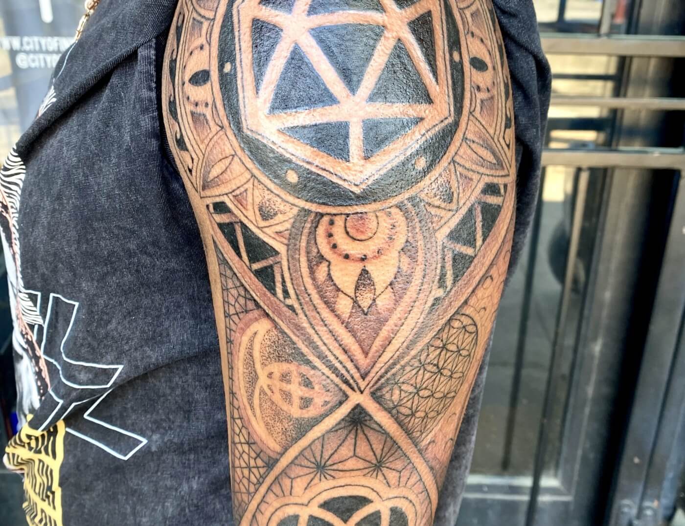 Geometric Mandala tattoo by Lyric The Artist at Iron Palm Tattoos in south downtown Atlanta. Mandala tattoos have their origins in Hindu and Buddhist cultures, where mandalas are used as spiritual and ritual symbols. The word "mandala" comes from Sanskrit and means "circle" or "center." What do you think? Let us know in the comments. Iron Palm is open late night until 2AM. Call 404-973-7828 or stop by for a free consultation.