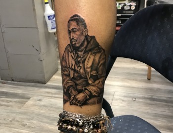 Tupac Shakur Memorial Portrait in Black & Grey By Choze At Iron Palm Tattoos. We're open late night most nights until 2AM. Call 404-973-7828 or stop by for a free consultation.