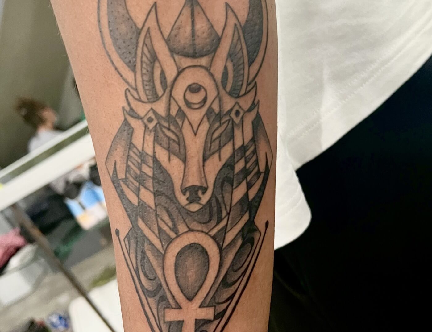 Anubis Tattoo By Funk Tha World At Iron Palm Tattoos In Atlanta, GA. Anubis, the Egyptian God, is a symbol of protection, guidance, or transformation. For some he is also a symbol of judgement. Call 404-973-7828 or stop by for a free consultation with Funk. Walk-ins are always welcome.