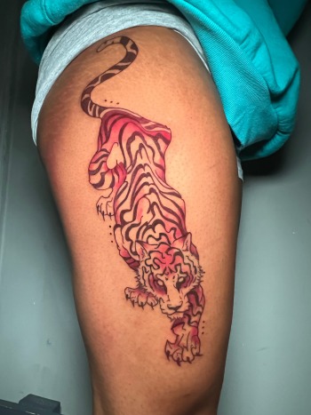 Red Tiger Tattoo By Funk Tha World at Iron Palm Tattoos In Atlanta. Combining the color red with a tiger tattoo signifies the intensity of the tiger's strength and the passion of the person wearing the tattoo.We're open late night until 2AM. Call 404-973-7828 or stop by for a free consultation.