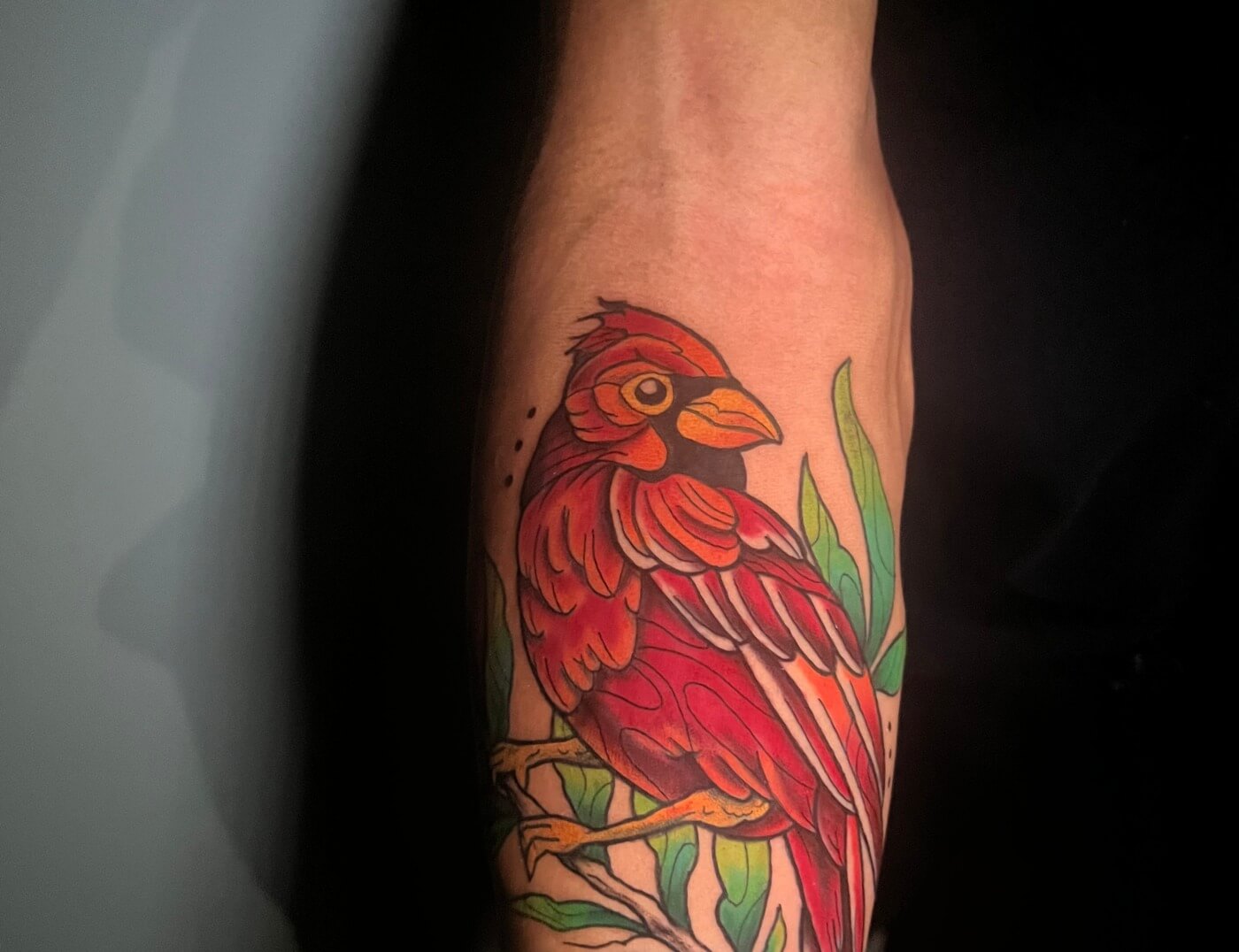 Red Cardinal On A Twig By Funk Tha World At Iron Palm Tattoos & Body Piercing In Atlanta, GA. We're open until 2AM most nights. Call 404-973-7828 or stop by for a free consultation.