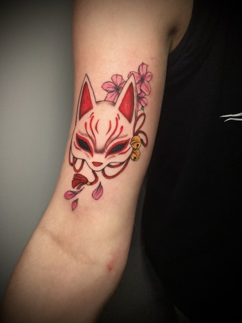 "Kitsune No Yomeiri," Kitsune Fox Mask Tattoo by Funk Tha World at Iron Palm Tattoos in downtown Atlanta, GA. Kitsune no yomeiri, or the fox's wedding, is a popular folktale in Japan that tells the story of a fox who transforms into a beautiful woman and marries a human. The story is often seen as a metaphor for the transformative power of love and the idea that true love can transcend societal norms and barriers. We're open late night until 2AM and accept walk ins. Call 404-973-7828 to schedule a free consultation with Funk.