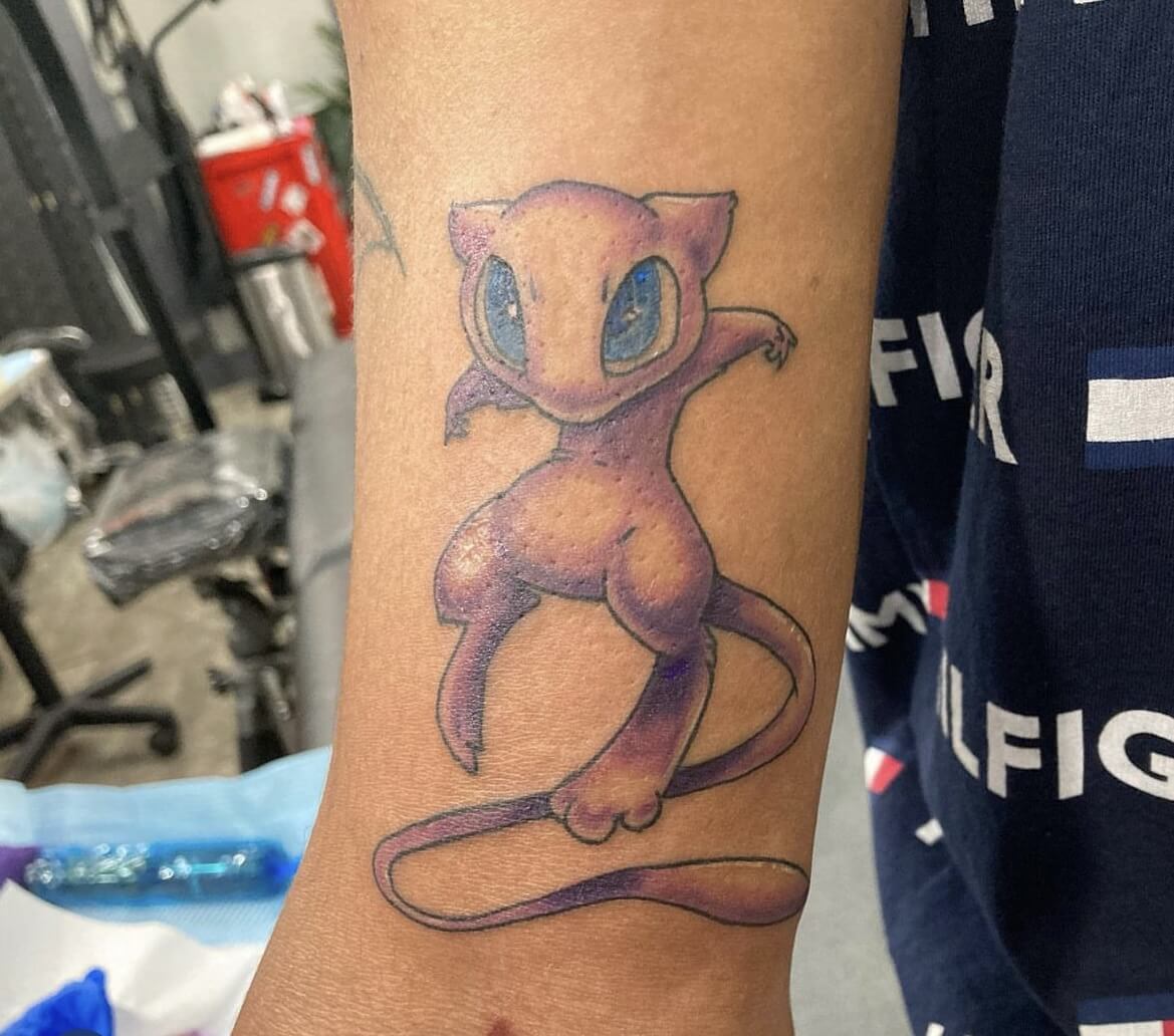 Mew Pokemon Anime Tattoo By Funk Tha World At Iron Palm Tattoos In Atlanta, GA. Call 404-973-7828 or stop by for a free consultation with Funk. Walk Ins are accepted.