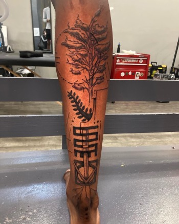 Tree Of Life With Adrinka Symbols Tattoo In Black & Grey By Funk Tha World At Iron Palm Tattoos. Call 404-973-7828 or stop by for a free consultation with Funk. Walk ins are welcome.
