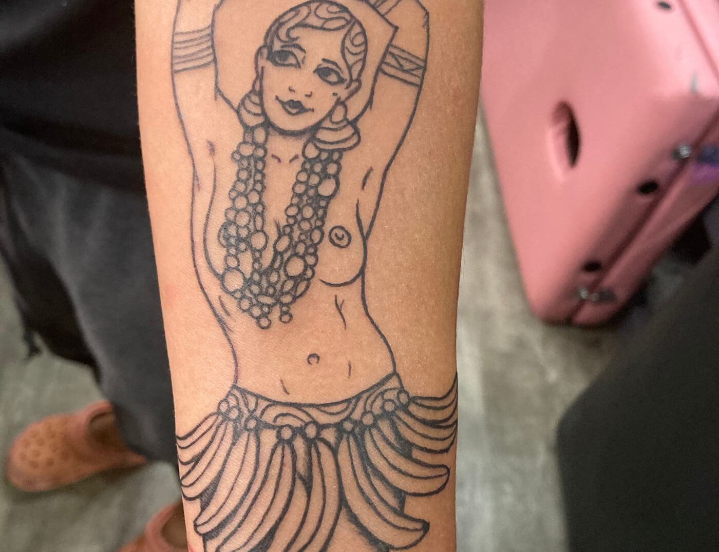 Josephine Baker Black & Grey Banana Dance Tattoo By Funk Tha World At Iron Palm Tattoos In Atlanta, GA. Her iconic topless banana dance performance, in which she wore a skirt made of bananas, has become an enduring symbol of female empowerment and black pride. We're open late night most nights until 2 AM. Call 404-973-7828 or stop by for a free consultation with Funk or another Iron Palm body artist. Walk Ins are welcome.