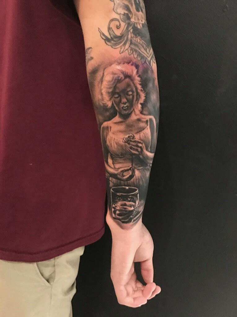 JR Outlaw Tattoos a Marilyn Monroe Photo Realism Tattoo At Iron Palm Tattoos. We're open late night til 2AM. Call 404-973-7828 to schedule a consultation with JR.