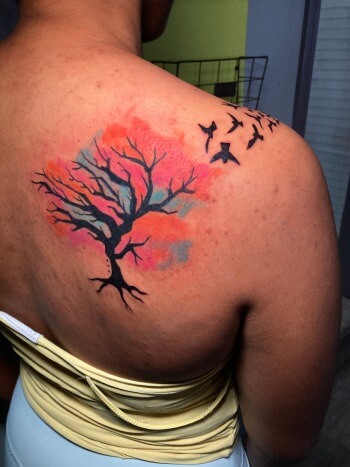 Tree & Bird Flock With Water Colors Tattoo By Funk Tha World At Iron Palm Tattoos In Atlanta, GA. We're open late night until 2AM. Call 404-973-7828 or stop by for a free consultation with Funk. Walk Ins are welcome.