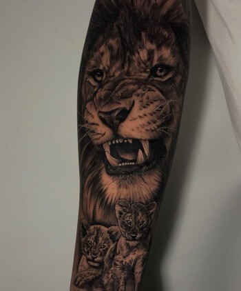 'Lion & His Cubs' Black Photo Realism Animal Tattoo By Rene Cristobal, A Guest Artist At Iron Palm Tattoos In Atlanta, GA. Rene is available for booking July 3rd - 16th, 2023. We're open late night til 2AM. Call 404-973-7828 or stop by for a free consultation. Walk ins welcome.