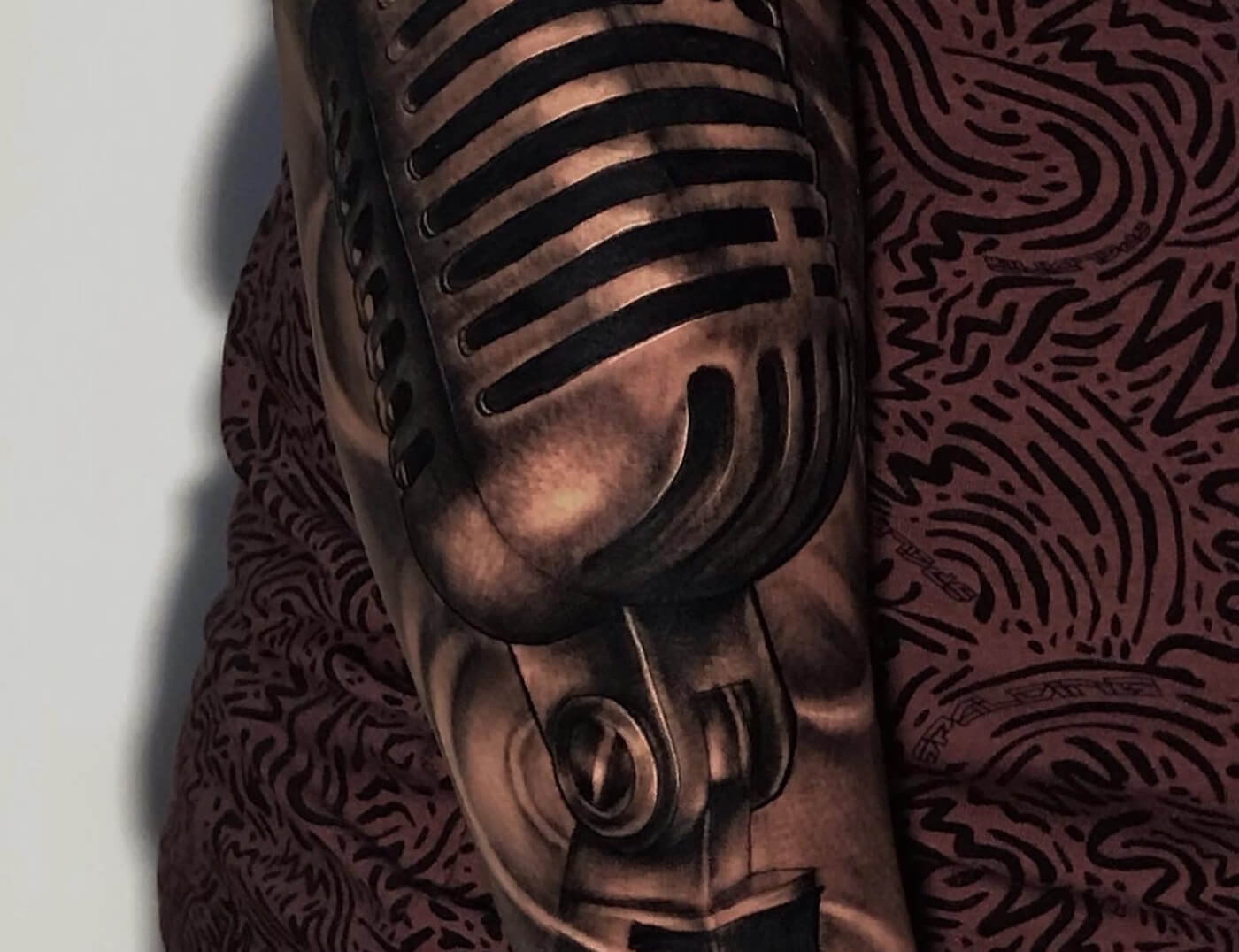 Music Microphone Sleeve Black & Grey Tattoo By Rene Cristobal, A Guest Tattoo Artist At Iron Palm Tattoos In Atlanta. Rene is from Vision Tattoo Studio in Concepcion, Chile and is booking for July 3rd - July 16th, 2023. We're open late night until 2AM. Call 404-973-7828 or stop by for a free consultation. Walk Ins are welcome.
