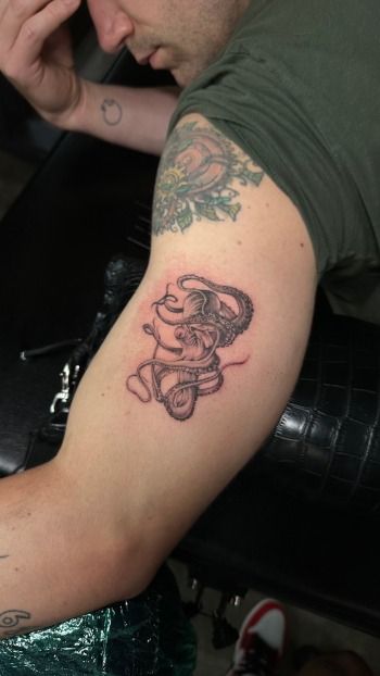 Octopus Black & Gray Realism Tattoo By Choze At Iron Palm Tattoos In Atlanta. Octopus tattoos symbolize knowledge and multitasking. Over the years it has also become a symbol for facing fears. We're open late night until 2AM most nights. Call 404-973-7828 or stop by for a free consultation.