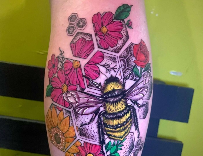Bumble bee & Flowers Abstract Art Tattoo by Lyric TheArtist at Iron Palm Tattoos In Atlanta. Tattoo done for Sunflower Skies IG: @sunflower.skyes. We like how roses, sunflowers, and lotus flowers are present below the bee as it would be in nature. We think this tattoo symbolizes life or new beginnings. We're open late night until 2AM most nights. Call 404-973-7828 or stop by for a free consultation. Walk-Ins are welcome during business hours.
