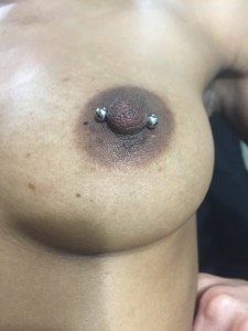 Nipple Barbell Piercing Done At Iron Palm Tattoos In Atlanta, Georgia. Atlanta's only late night tattoo shop. We're open until 2AM most nights. Call 404-973-7828 or stop by for a free consultation. Walk-Ins are welcome.