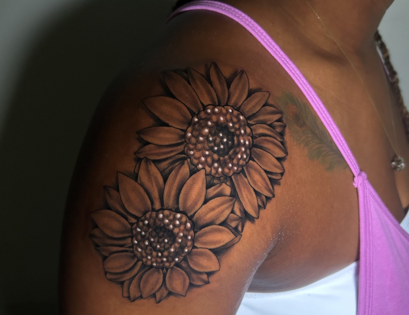 Sunflower Photo Realism Blackwork Tattoo By Lyric TheArtist. We love the attention to detail and the way Lyric uses the skin tone of the muse as "lighting". We're open until 2AM most night. Call 404-973-7828 or stop by for a free consultation with Lyric. Walk-ins are welcome.