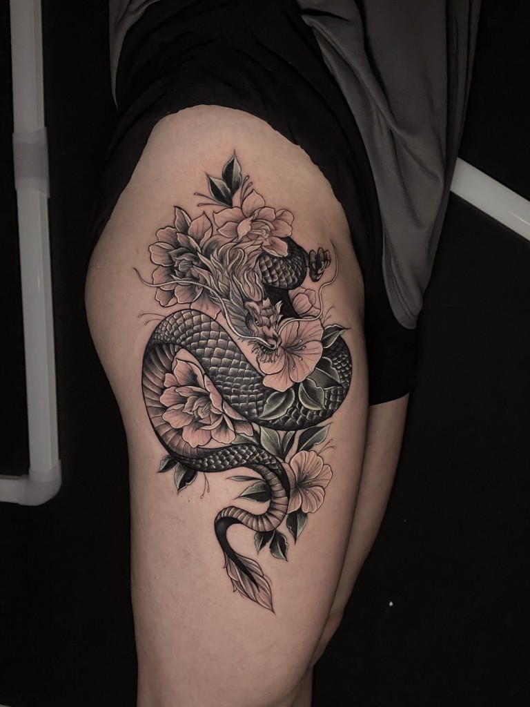 Blackwork Dragon & Cherry blossom Tattoo By Rene Cristobal at Iron Palm Tattoos in Atlanta. Rene is currently guesting at Iron Palm Tattoos from Sept 11th until Sept 18th, 2023. Rene is available for booking on IronPalmTattoos.com.