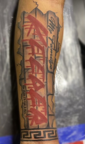 "My Family's Keeper" Lettering Tattoo By Khem At Iron Palm Tattoos. Khem is a tattoo artist and master body piercer at Iron Palm Tattoos. Iron Palm is Atlanta's only late night tattoo shop. Call 404-973-7828 or stop by for a free consultation.