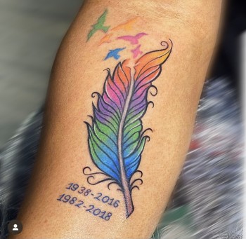 Sentimental Dates For Feather Tattoo By Khem At Iron Palm Tattoos. The customer wanted a colorful but gentle representation of lost love ones. Khem designed this color tattoo based on a leaf image. We're Atlanta's only late night tattoo shop. Call 404-973-7828 or stop by for a free consultation.