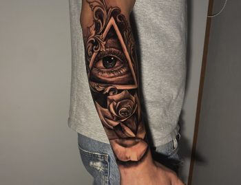 'All Seeing Eye' AKA "The Eye of Providence" And Rose Surrealism Blackwork Tattoo By Rene Cristobal. Rene is a resident artist at Iron Palm Tattoos. He is from Concepcion, Chile and is fluent in Spanish. The "Eye of Providence" is usually depicted in a triangle to signal an all seeing deity peering into our world from other dimensions.