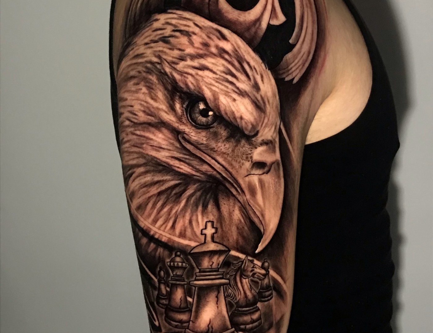 'Eagle, Chess, and Waves' Blackwork Tattoo by Rene Cristobal. This piece was done by Rene while still in Concepcion, Chile at his Alma Marta, Vision Tattoo Studio. Rene specializes in blackwork and black & gray realism tattoos. Stop by Iron Palm for a free consultation.