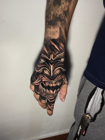 Oni Mask Solid Blackwork Hand Tattoo By Rene Cristobal At Iron Palm Tattoos