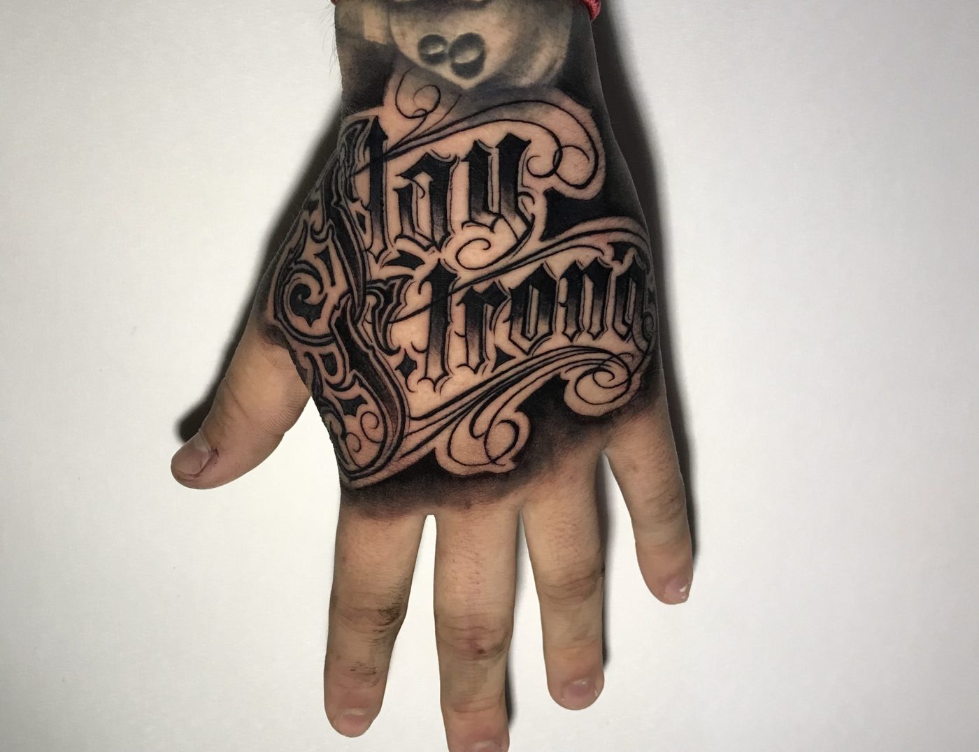 "Stay Strong" Script Lettering Tattoo By Rene Cristobal At Iron Palm Tattoos. Rene is an international tattoo artist from Concepcion, Chile. He specializes in many styles including blackwork and black & gray tattoos.