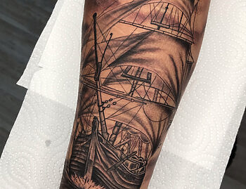 Ship Sailing At Sea Photo Realism Blackwork Tattoo By Rene Cristobal. Rene is a spanish speaking tattoo artist at Iron Palm Tattoos. Call 404-973-7828 or stop by for a free consultation with Rene. Walk Ins are welcome.